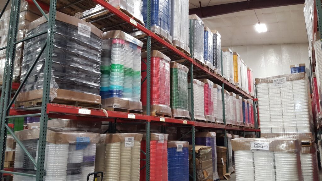 Palletized plastic buckets and lids stocked in the Affordable Buckets warehouse